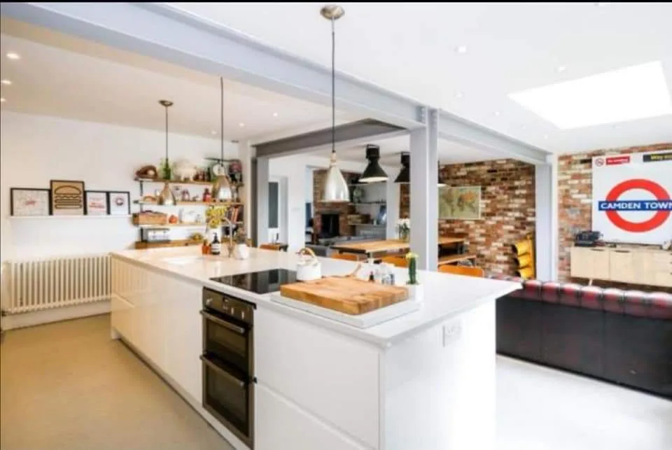 White J-pull handleless kitchen installation in Cuffley