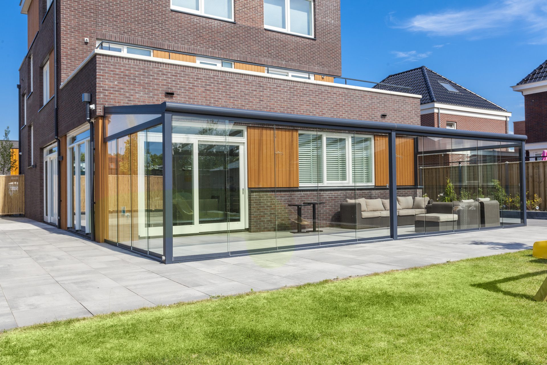Wall mounted pergola with glass sliding doors